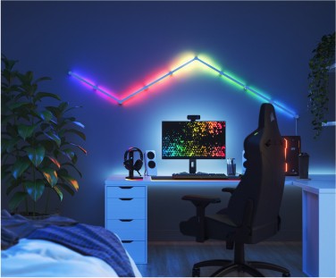 Numark Mixstream Pro DJ controller in a home studio in front of Nanoleaf Shapes RGB light panels. The perfect smart lights for parties or live streams.