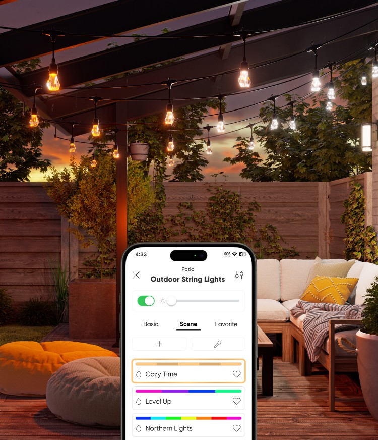 Outdoor wooden patio with multicolor outdoor string lights over a cream-colored corner couch. Two floor pillows and the lawn are visible. An iPhone graphic displays the Nanoleaf app's Scene Selection page for outdoor string lights.