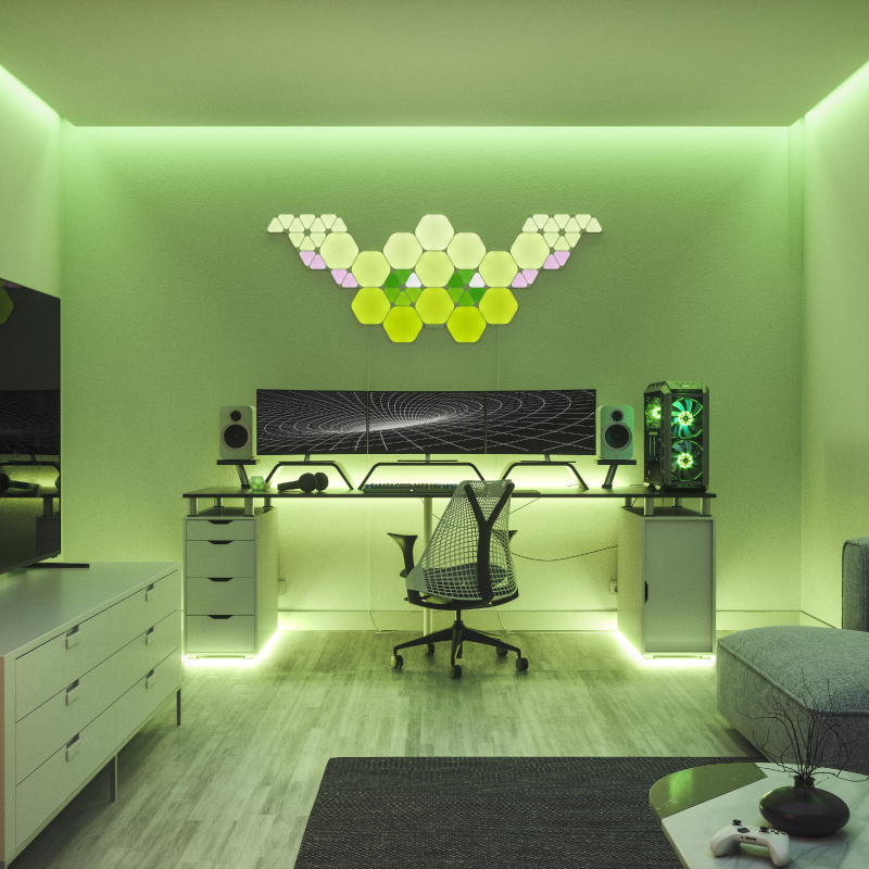 Nanoleaf Shapes Thread-enabled color-changing hexagon smart modular light panels mounted to a wall above a battlestation. Similar to Philips Hue, Lifx. HomeKit, Google Assistant, Amazon Alexa, IFTTT.